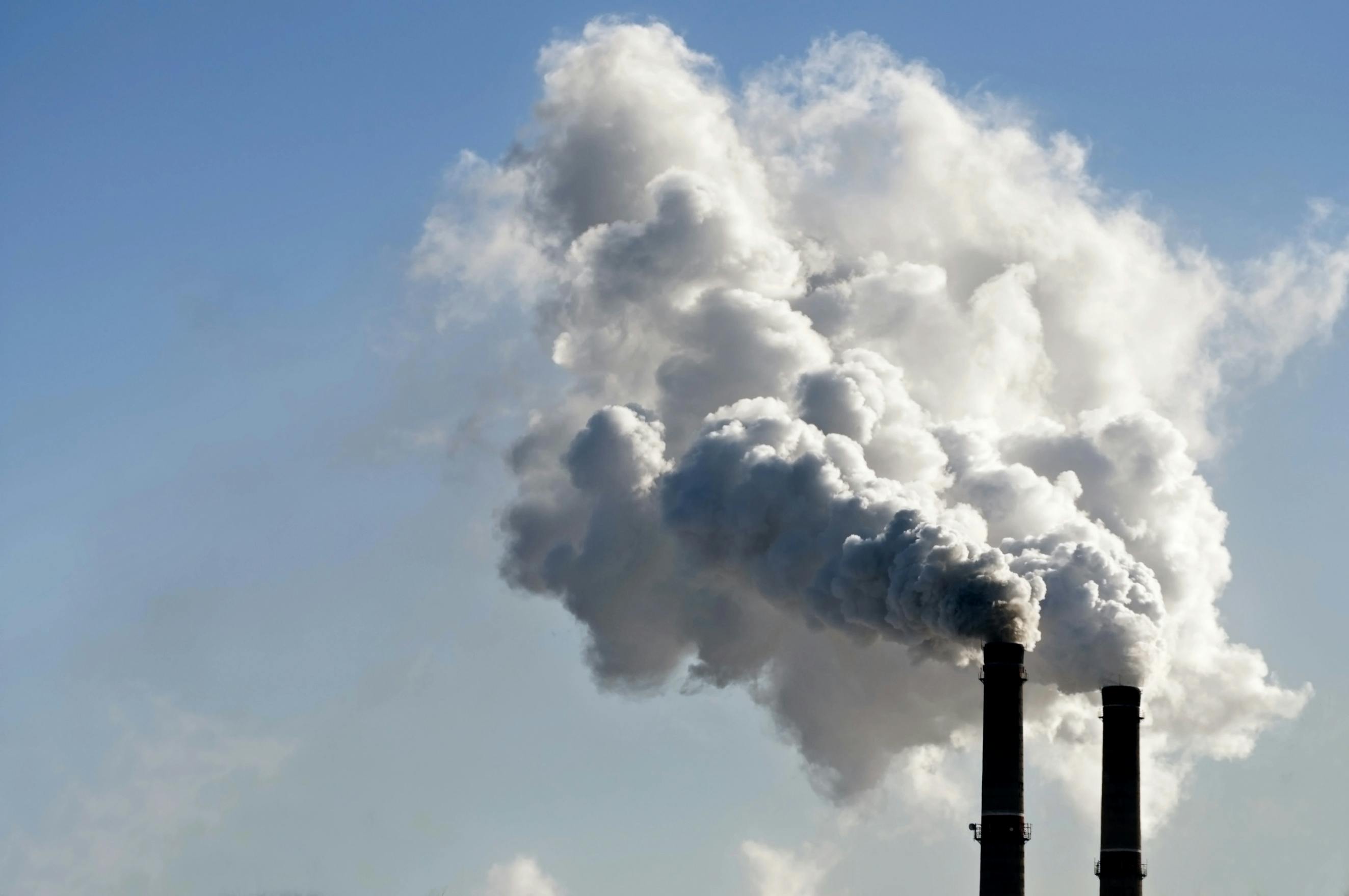 Industrial chimneys emitting visible pollution